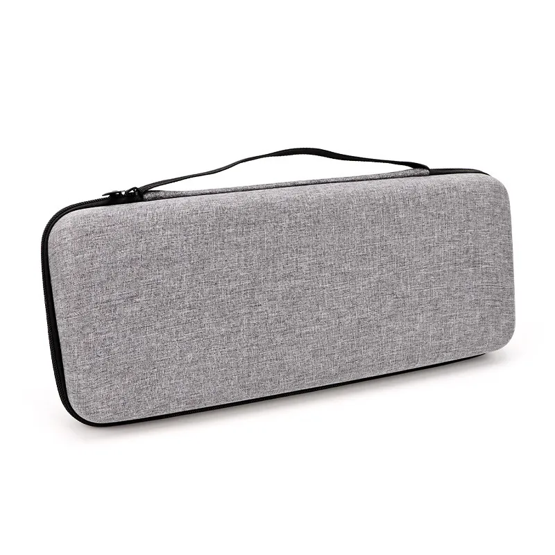 Grey EVA hard-shell keyboard case in snowflake cloth, closed, with the carry handle